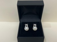 Boucles d'oreilles nœud or 750, diamants & perles