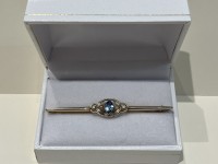 Broche or 750 topaze