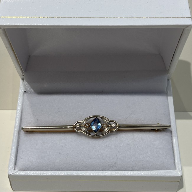 Broche or 750 topaze